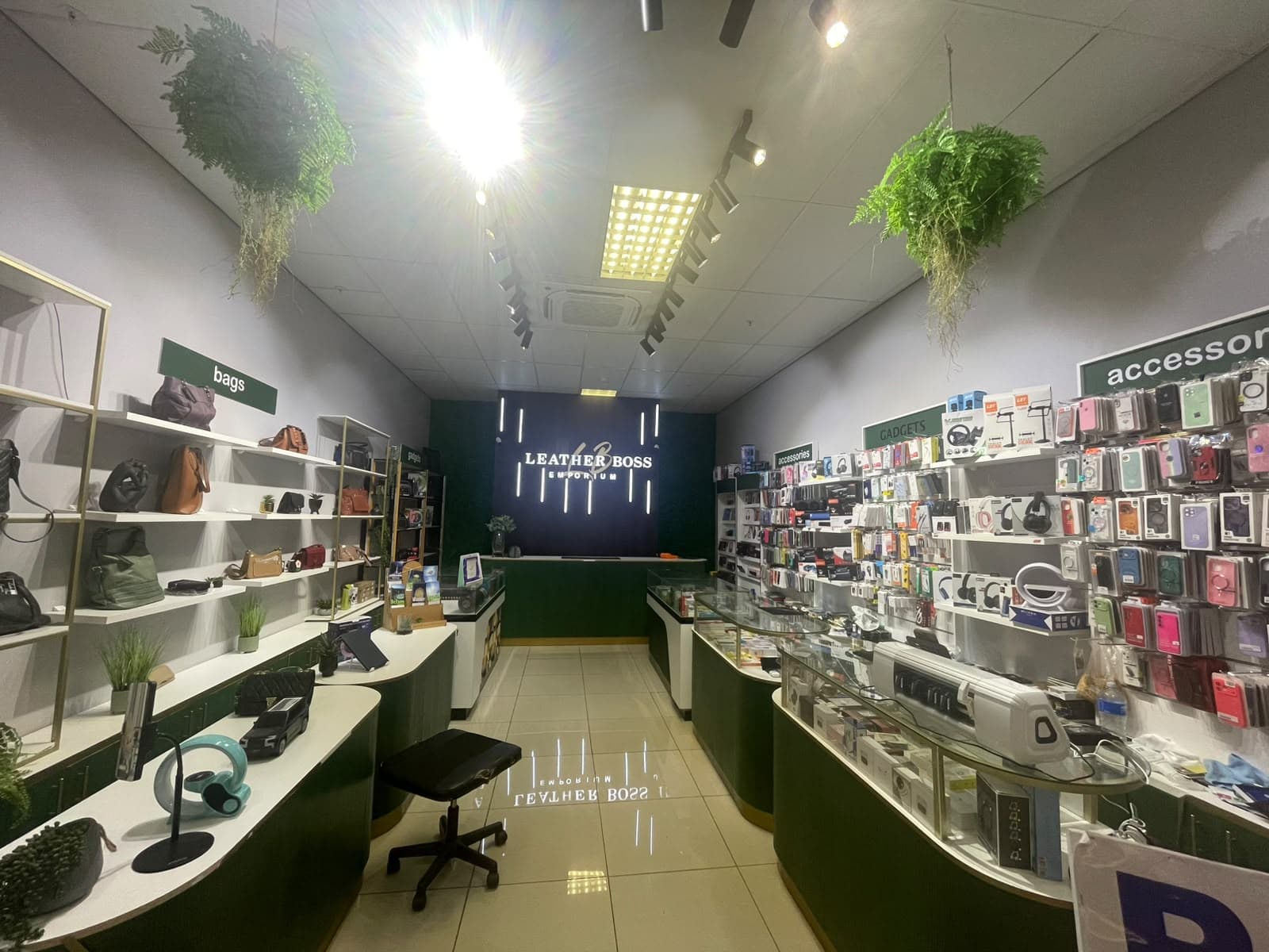 Phone and accessory displays inside the Leather Boss store